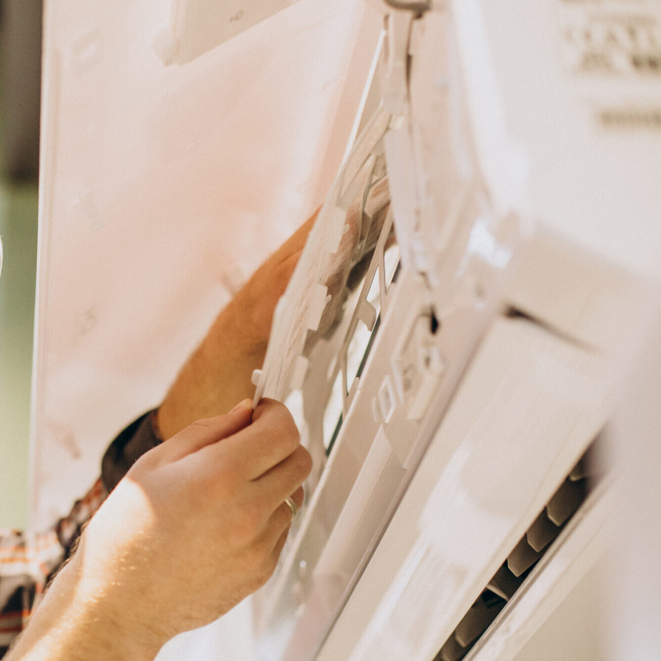 repairman-doing-air-conditioner-service-1-scaled-e1747151155377.jpg